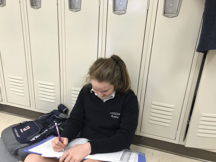 Callie ONeill studying at her locker.