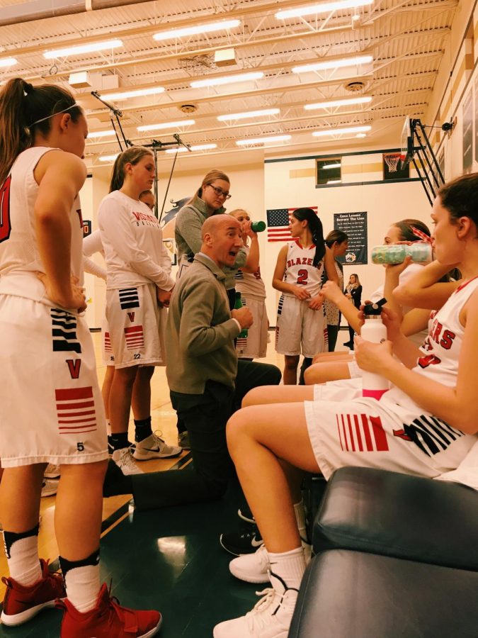 Coach OBrien advises Lady Blazers about the next play.