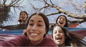 Grace Keeley with friends  Ella Bergeron, Paige Abbott, and Emily Fenlon hammocking on a beautiful day! Photo Courtesy of Grace Keeley